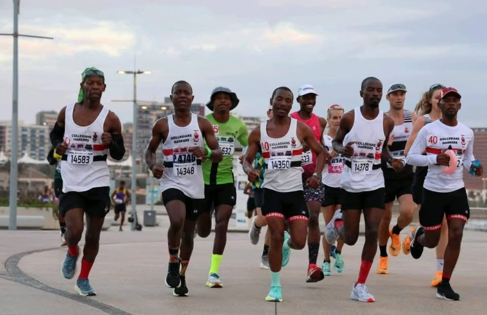 Collegians Harriers runners racing together in club colours